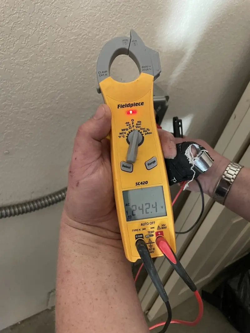 Voltage testing with clamp meter during Ceiling Fan Installation in Metropolis